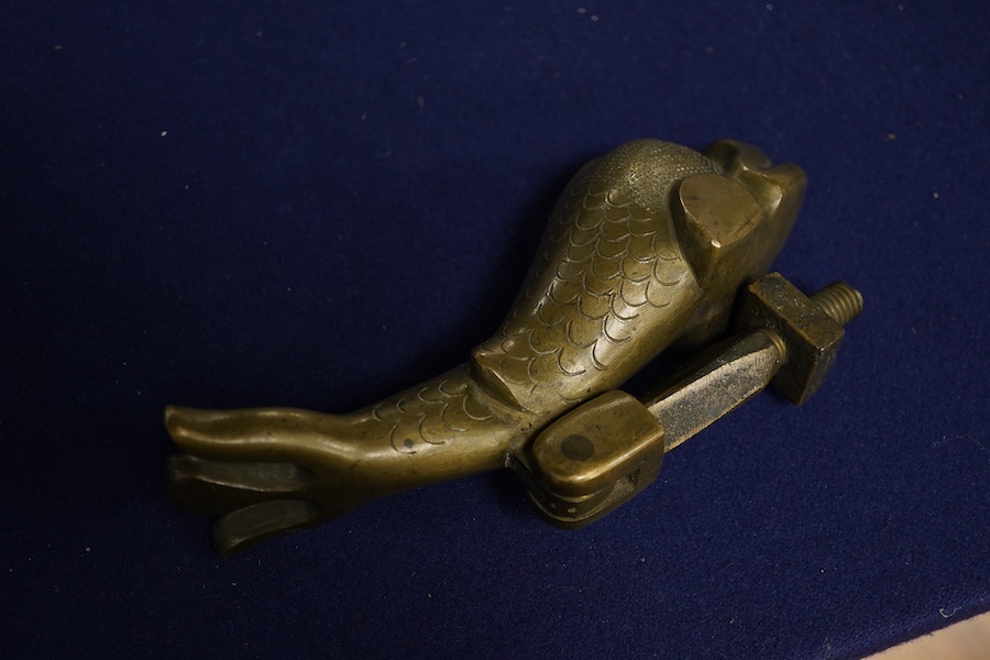 An early 20th century bronze ‘dolphin’ door knocker, 20cm